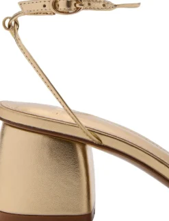 Heeled sandal with crossed straps